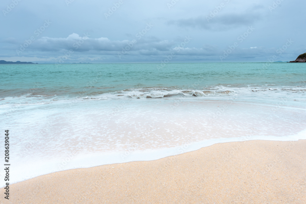 Soft waves on the sand beach