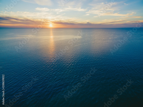Sunset over ocean aerial view