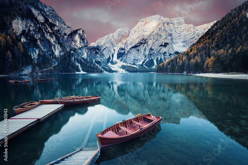 Fototapeta Naklejka Na Ścianę i Meble -  Wooden boat at the alpine mountain lake
