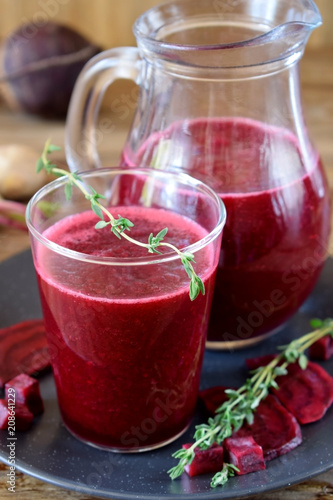 Wallpaper Mural Beet smoothie in a glass and a jug. Thyme and beetroot pieces are around Torontodigital.ca