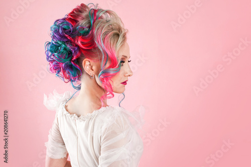 Stylish and trendy girl in a white dress. Creative hair coloring. Multi-colored hairstyle