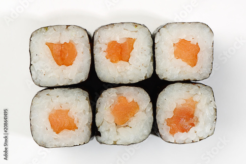 Rolls of Hosomaki with smoked salmon, top view, white background