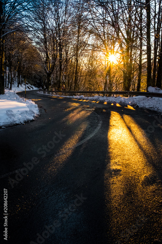 Asphalt road and curve in the italian countryside.