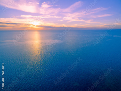 Minimalist aerial seascape - sunset over calm water