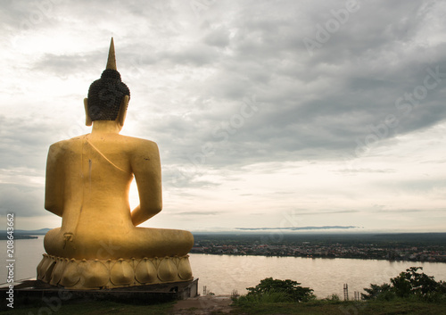 Buddha statue with river on background