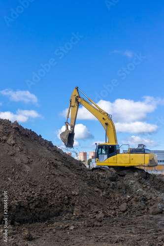 excavator digs the earth
