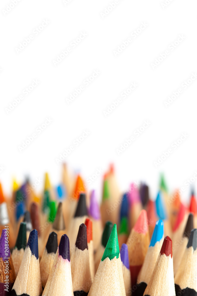 Many rows of sharp colored pencils with focus on foreground - vertical image with copy space Many rows of sharp colored pencils with focus on foreground - vertical image with copy space
