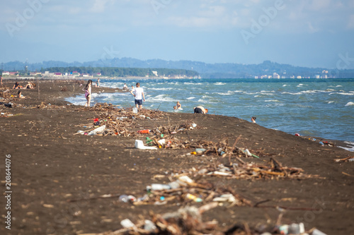 The problem of pollution and ecology of the sea shore and the ocean. Garbage on the coastline and in the world