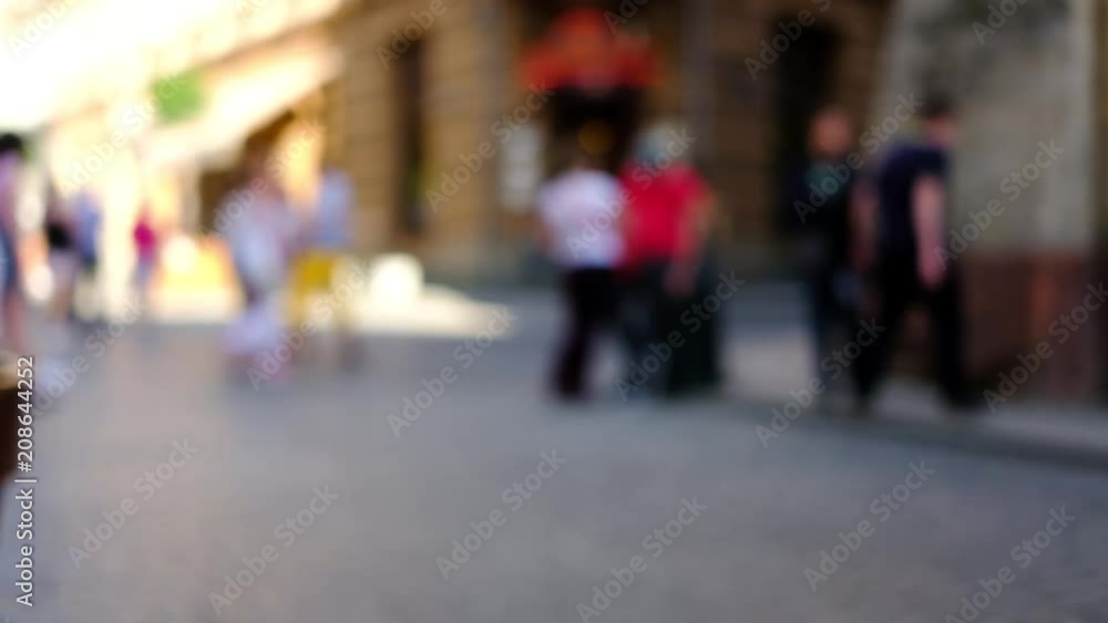 People walking in city. Pedestrians walking in city. Out of focus background. People walking in city. Pedestrians walking in city. Out of focus background.