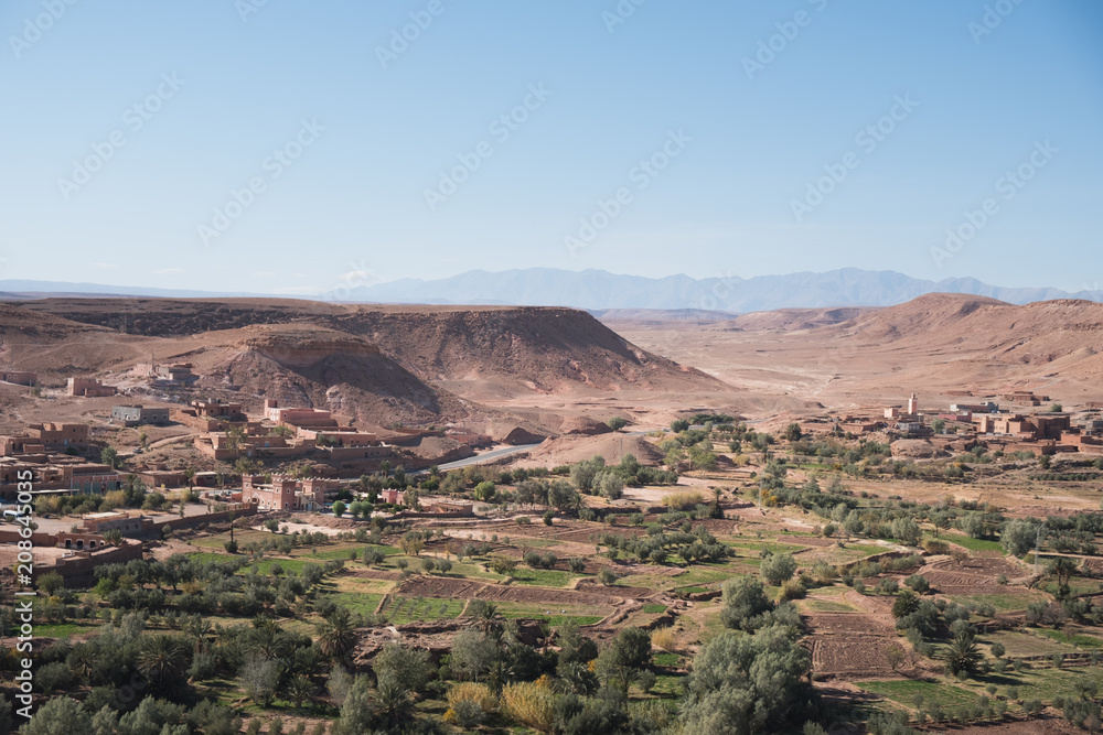 Morocco, Imlil: photo of old town in sandy mountains in hot summer with blue sky
