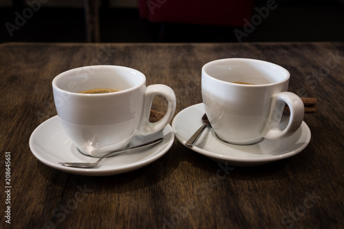 coffee cups on wood table in cafe