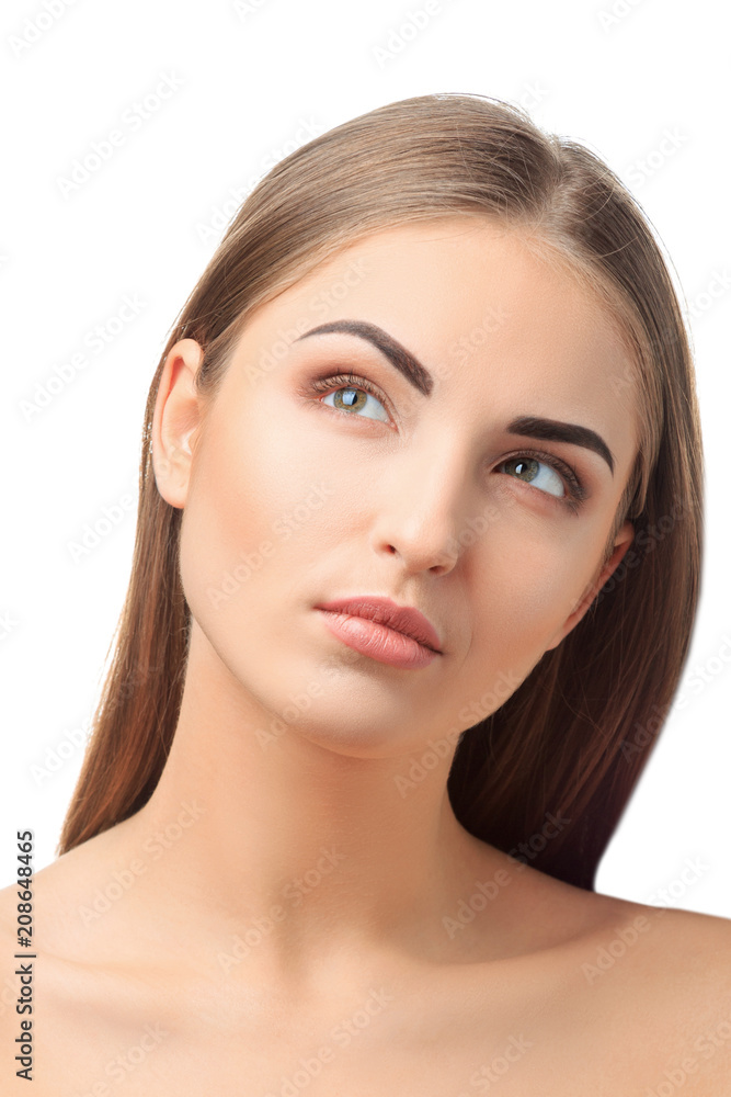 Portrait of a dreaming girl on a white background