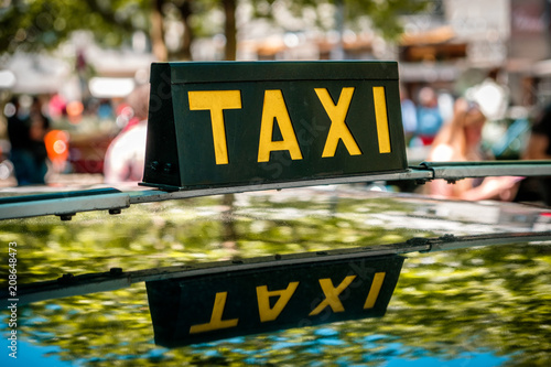 vintage taxi sign on car roof - cab driver -