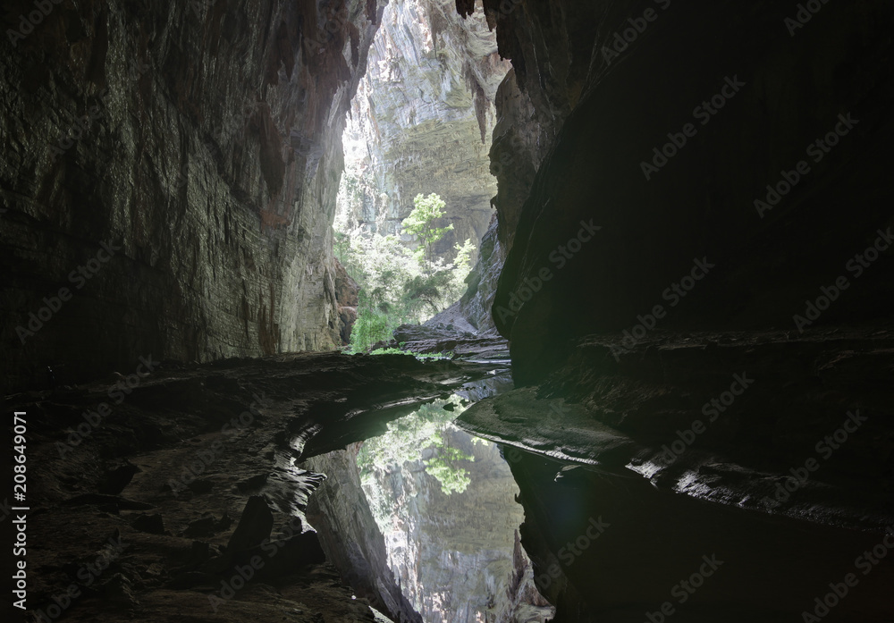 Fototapeta premium A river runs under a giant cave in southeast Brazil