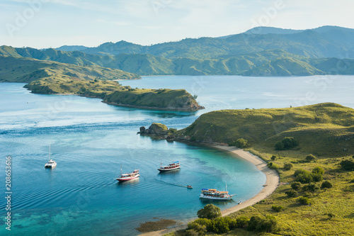 Tourist boats from the top view of 'Gili Lawa' in an evening, Komodo Island (Komodo National Park), Labuan Bajo, Flores, Indonesia photo