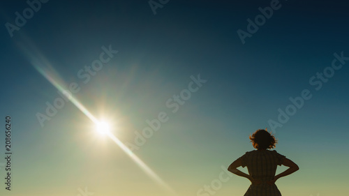 Fototapeta Naklejka Na Ścianę i Meble -  Tourist woman on enjoying sunset