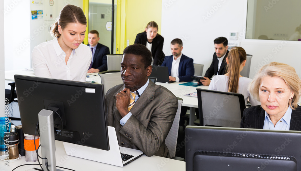 Fototapeta premium Business people working in open plan office