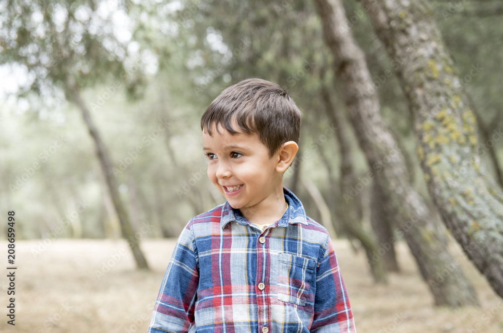 Handsome little boy posing in the park Handsome little boy posing in the park