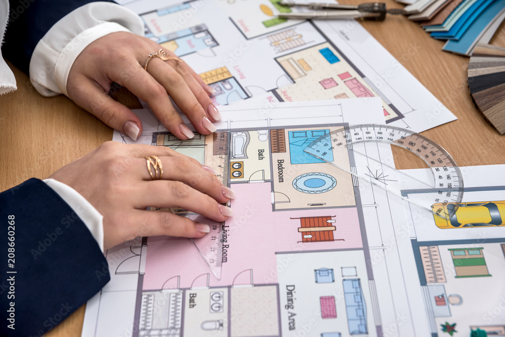 Woman makes measurements of the house project Woman makes measurements of the house project