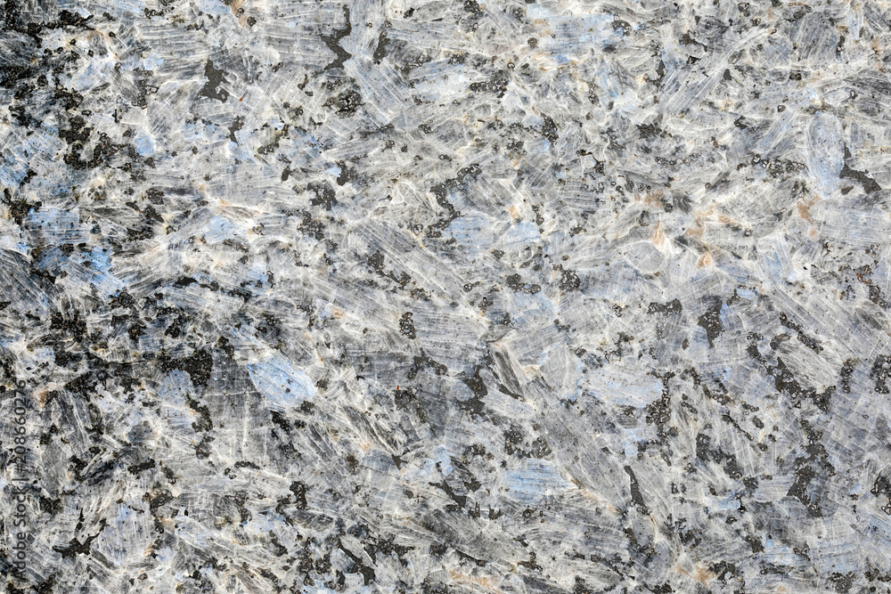 Granite, basalt or marble stone crystal texture of polished gravestone. The macro shot is made by means of stacking technology Granite, basalt or marble stone crystal texture of polished gravestone. The macro shot is made by means of stacking technology