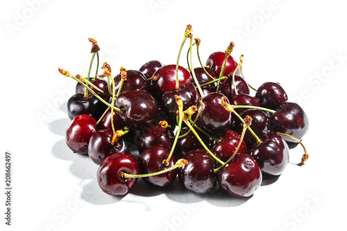 Pile of sweet cherry isolated on white background.