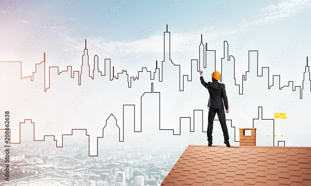 Man architect draw silhouette of modern city on blue sky. Mixed media Man architect draw silhouette of modern city on blue sky. Mixed media