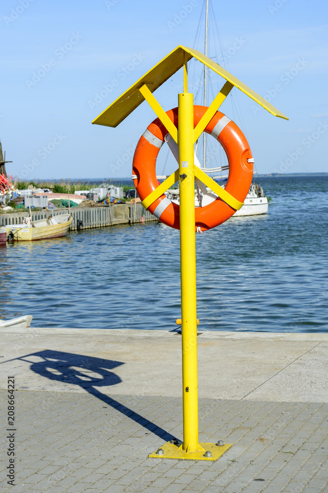Hanging lifebuoy at the Baltic sea port. Poland