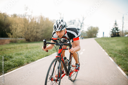 Cyclist in helmet and sportswear, bicycle training