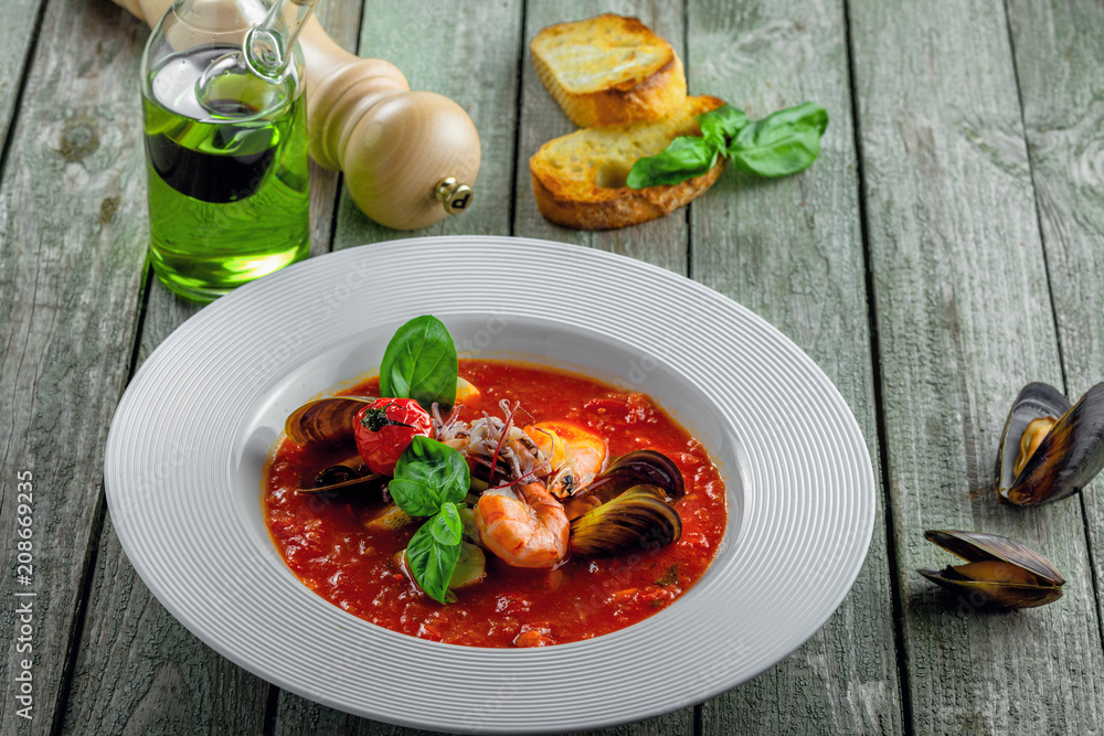 Delicious Italian tomato seafood on a table. Plate of classic healthy vegetable food.