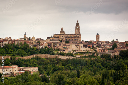 viewpoint of Segovia. Gothic cathedral, Romanesque churches, aqueduct. Segovia skyline in spring, gray sky. Spain. Europe