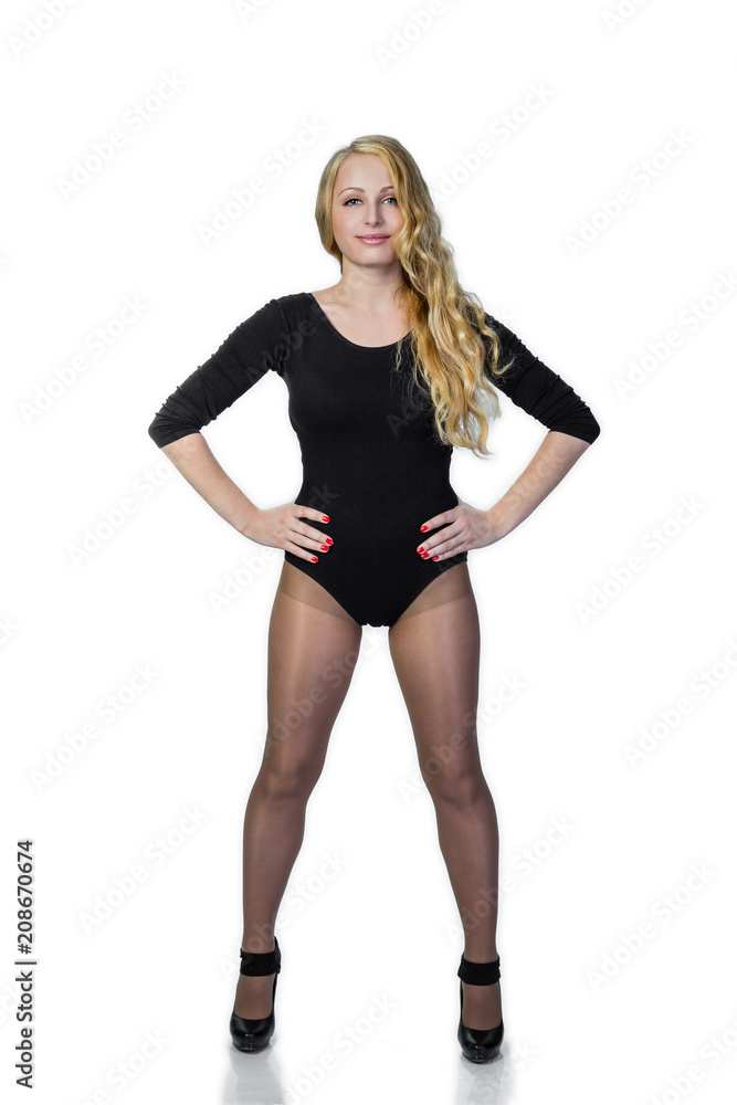 Young blonde woman in black posing. Young blonde woman in black posing.