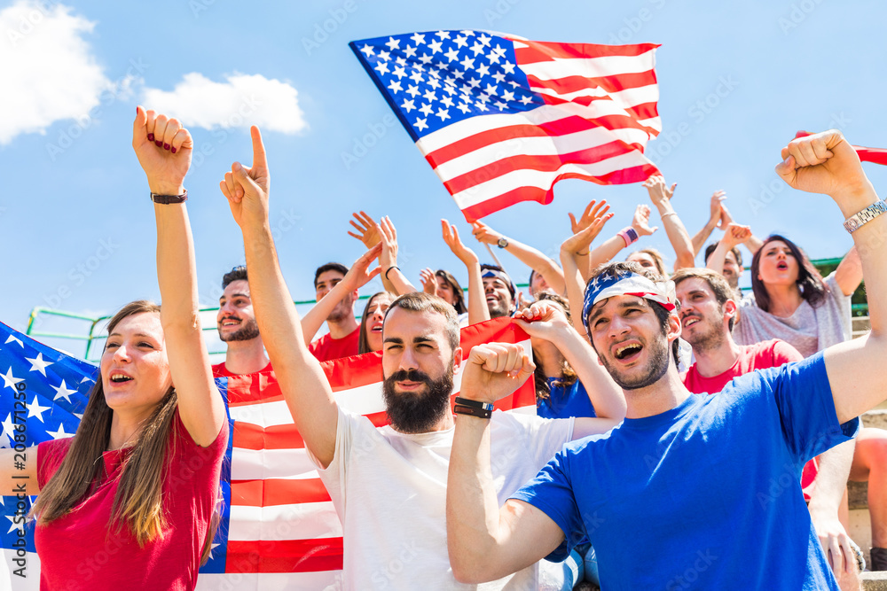 © william87 - American fans cheering at stadium with USA flags