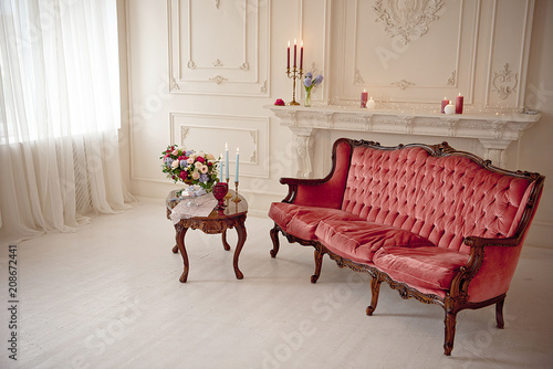 baroque style interior with red luxury sofa and table in the middle top view