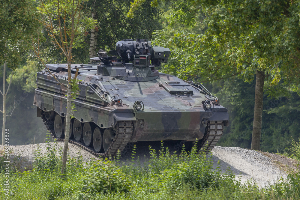 German infantry fighting vehicle drives on a road German infantry fighting vehicle drives on a road