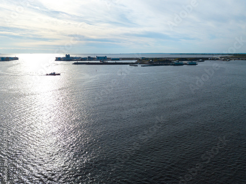 Wallpaper Mural Aerial view of the green red tugboat going along the Finnish Gulf  Torontodigital.ca