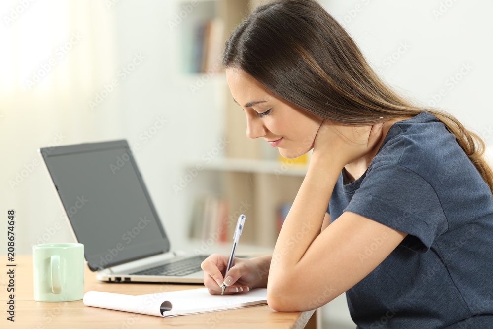 Single woman taking notes in a notebook Single woman taking notes in a notebook