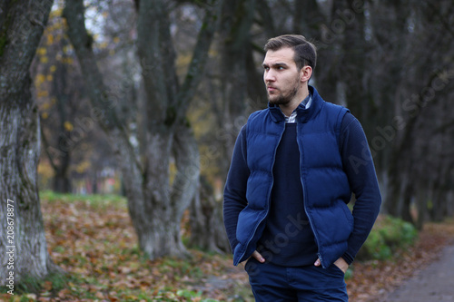 Young beard man in an autumn