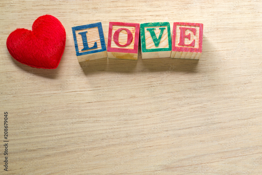 Heart and text love on wood background, valentine's day concept Heart and text love on wood background, valentine's day concept