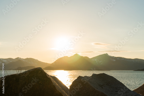 View over the Rorvikstranda beach and Gimsoystraumen fjord near Henningsvaer at Lofoten Islands / Norway at sunset photo