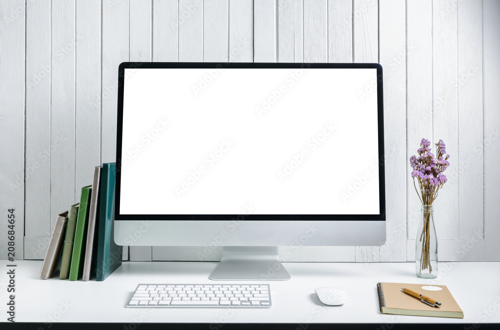 workplace background with Blank white screen modern desktop computer. White wooden vintage blackground workplace background with Blank white screen modern desktop computer. White wooden vintage blackground