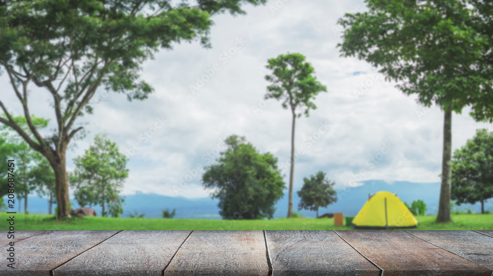 Selected focus empty brown wooden table and landscape blur background with bokeh image, for product display montage Selected focus empty brown wooden table and landscape blur background with bokeh image, for product display montage