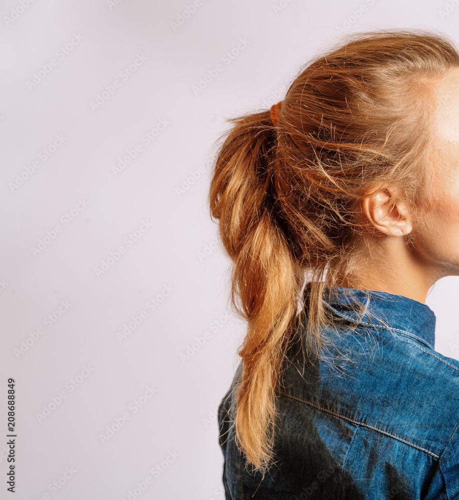 Ponytail With Copyspace. Beautiful Middle Age Blond Woman With Long Dyed Hair. Side View Studio Shot. Ponytail With Copyspace. Beautiful Middle Age Blond Woman With Long Dyed Hair. Side View Studio Shot.