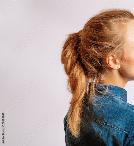 Ponytail With Copyspace. Beautiful Middle Age Blond Woman With Long Dyed Hair. Side View Studio Shot.