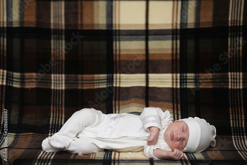 Newborn baby lying on the blanket