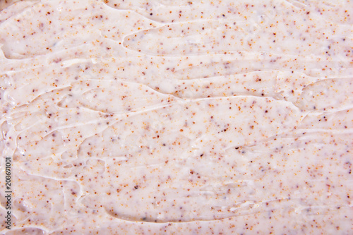 Fotografie Cosmetic cream scrub texture background.Cream body scrub texture