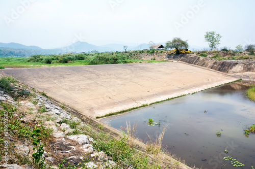 Small dam water release for excess capacity of water until spring-way overflow