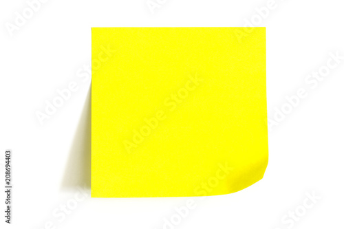 Empty yellow stick note paper on white background. Isolated photo.