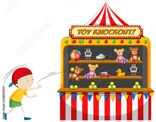 Boy playing toy knockout at carnival