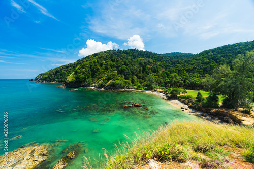 Summer seascape view with clear sea, green forest and blue sky on koh Lanta island in Thailand. © Korradol
