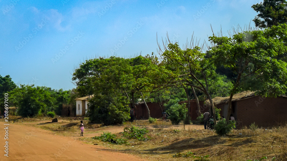 Girl searching for father in village in Malawi, Africa